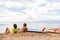 Couple surfing surfers relaxing on hawaii beach