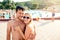 Couple in swimming suits at the pool, sunny summer