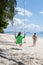 A couple on a swing on the beach in Phuket Thailand, men and women on a tropical beach in Thailand