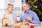 Couple at the table celebrating Christmas and New Year at home