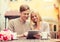 Couple with tablet pc in cafe