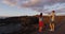 Couple taking photo using mobile phone in volcano mountains of Lanzarote