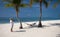 Couple taking picture at the perfect beach on hammock, Maldives