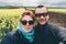 Couple taking selfie in canola field