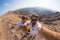 Couple taking selfie at the Fish River Canyon, scenic travel destination in Southern Namibia. Fisheye view from above in backlight