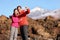 Couple taking selfie hiking in beautiful nature