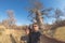 Couple taking selfie near Baobab plant in the african savannah with clear blue sky. Fisheye view from below, toned image. Wilderne