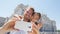 Couple taking selfie photo on smartphone in Madrid