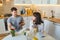 Couple talking at the kitchen in the morning drinking tea