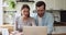 Couple talking using laptop discuss future online ecommerce purchase