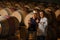 Couple tasting wine in a cellar