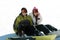 Couple teen snowboarders