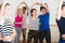 Couple of teens having dancing class indoors