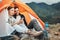 Couple, tent and camping with phone, smile and reading for holiday, web blog and morning in countryside. Man, woman and