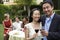 Couple Toasting Wine With Friends In Background