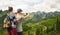 Couple tourist makes photo karst mountains.