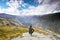 Couple tourist standing against amazing view, beautiful nature landscape hiking in Norway Trolltunga scandinavian