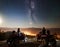 Couple tourists with atv quad bike under night starry sky