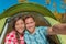 Couple tourists campers taking selfie in tent camping on summer adventure vacation travel smiling at camera. Faces self