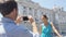 Couple tourists taking photo on smart phone in Madrid