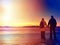 Couple tourists walk at background of beautiful hills and sky