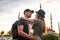 A couple of tourists a young man and a beautiful woman embrace against the world-famous Blue Mosque, also called