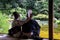 Couple in traditional clothes chilling in one of the Kyoto gardens during the summer heat, kyoto, kansai, Japan