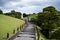 Couple in traditional clothing taking a stroll at the Suizenji Jojuen Garden