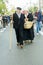 A couple in traditional country clothes wearing clogs during the sheep transhumance festival passing through Madrid Spain