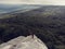 Couple travel and stand on the cliff edge enjoy the view to the nature forest