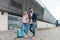 Couple travel with suitcases at the airport. Love travel and transportation with technology concept