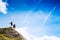 Couple of travelers on top of a mountain. Mangart, Julian Alps,