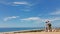 couple travelers tourists walking sandy dunes on beautiful Patara Beach on Mediterranean sea coastline. stunning desert