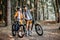 Couple traveling with bicycles in the forest