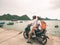 Couple traveling together by motorbike, adult man and woman having fun at Halong Bay and Cat Ba island, famous tourist destination