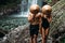 The couple travels the world. Vacation in Asia. A couple in love on a waterfall. Man and woman in conical hats at a waterfall