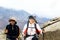 Couple trekkers hiking in mountains