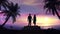 Couple on the tropical sunset background