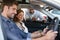 Couple trying car at dealership