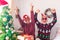 Couple of two crazy and funny seniors playing having fun together and celebrating doing a party at home the christmas day before