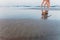 Couple of two lesbian women in love walking on a LGBT beach