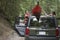 Couple Tying Kayak On Car Roof