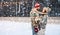 Couple in ugly sweaters on christmas ice rink