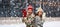 Couple in ugly sweaters on christmas ice rink