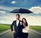 Couple under black umbrella at outdoor