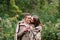 Couple under the plaid in an autumn romantic forest. Autumn wedding outdoors.