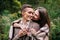 Couple under the plaid in an autumn romantic forest. Autumn wedding outdoors.