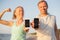 Couple using fitness app on their mobile phones