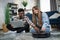 Couple using laptop for controlling robot vacuum cleaner