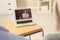 Couple using laptop at home for online consultation with psychologist via video chat